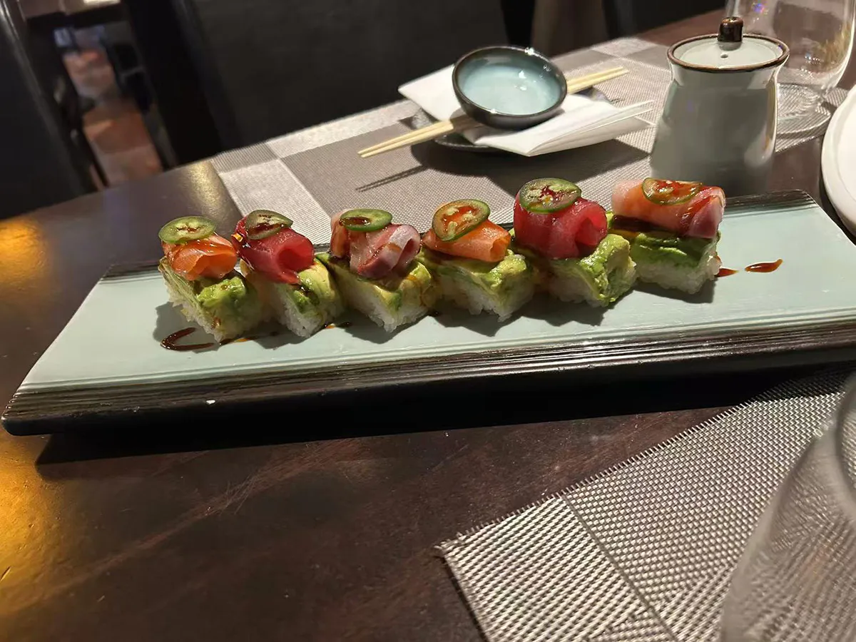 Colorful sushi roll topped with fresh fish at Sushi Empire, a Japanese Restaurant in New Haven